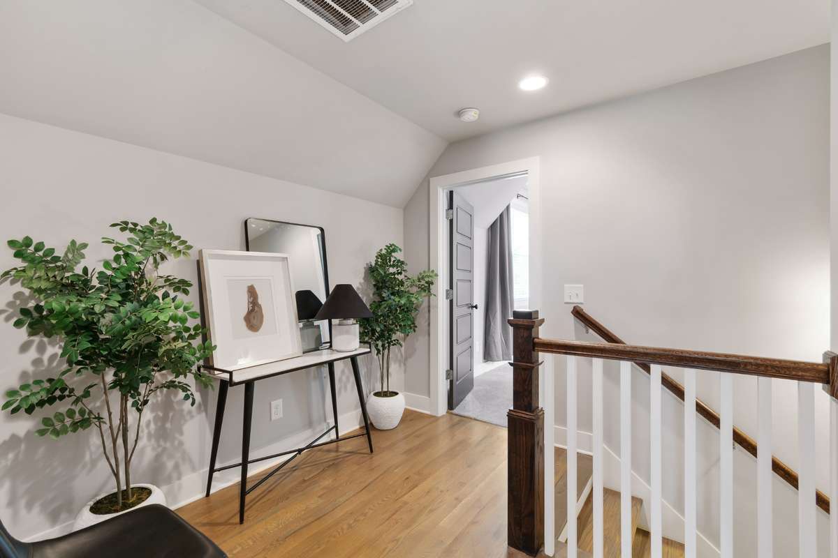 The upstairs landing provides a bit of flex space - ideal for a small home office, homework station, or just extra storage cubbies.