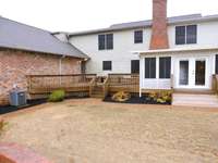 Manufactured wood deck accessing the Florida room and kitchen.