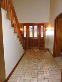 Foyer with vaulted ceiling.