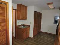 What a laundry room!  Built in cabinets, pantry storage, washer and dryer closet and wash area.  This room currently holds an additional upright freezer and upright wine cooler.