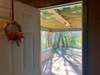 A peek from the Spacious Laundry Room to the Carport