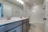 Secondary bathroom with double sinks (very similar completed home)