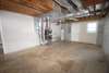 Laundry area and unfinished portion of basement