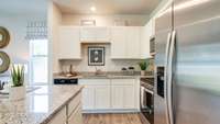 White Cabinets throughout, SS appliances and granite countertops