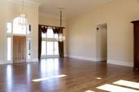 The combination dining area includes a gorgeous, Schonbeck crystal chandelier.