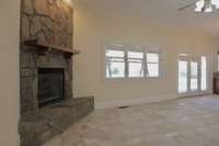 Stone on the fireplace in the morning room was shipped in from the Snake River and the mantle came from a single, black walnut tree from the Owner's former home.