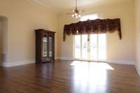 Formal living and dining has 18 ft ceilings and gleaming, sand and finish wood floors.