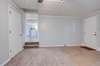 Located off the kitchen (converted garage) with fresh paint & new carpeting...