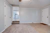 Located off the kitchen (converted garage) with fresh paint & new carpeting...