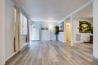 The open floor plan greets you at the front door with freshly painted walls & easy care laminate floors...