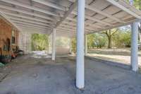 Covered carport can be used for additional outdoor living space or to house your cars, motorcycles or toys...