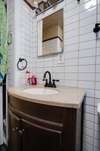 Custom tile work throughout, updated vanity & faucet...