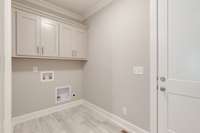 Spacious Laundry Room w/ Built In Cabinets