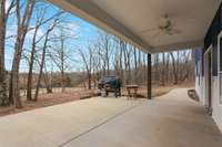 Front covered concrete porch which leads around to an access door from the master bedroom.