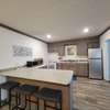 Kitchen with stove and refrigerator.  All furniture stays