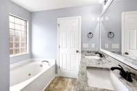 Primary Bath with granite countertop, separate Tub and shower