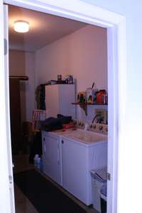 New laundry room built in the garage area.