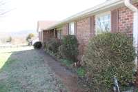 Walkway leading to front porch and double door entrance.