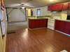 This is a view of the Kitchen and Living room before new flooring had been installed.