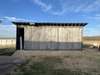 Large Shed with Lean-to off the back. Large Door rolls open left to right.  