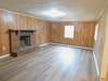 Laminate flooring, newly installed, and handy pass thru to the Kitchen/dining area