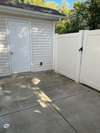 Fully enclosed rear patio with additional storage closet