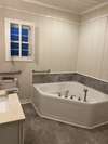 Large primary bath has been recently repainted for a calm, soothing vibe with a soaking tub and a walk-in shower.