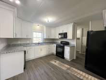 Granite counters in the kitchen.  All appliances to remain.