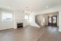 This Great room offers a large open feel and cozy fireplace. Built ins can be added.