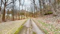 Driveway view as you past brick ranch and approach 7431 & 7433 River Road Pike.