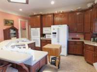 All Crisp White appliances Accessorize Larger Kitchen, double ovens,