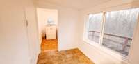 Area between shower and laundry room, perfect sitting area.