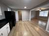 Kitchen towards side entry door and utility room.