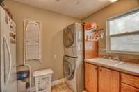 Spacious laundry room with ample storage & counter space