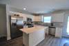 Kitchen with stainless steel appliances and granite countertops