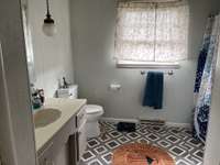 ...your full bathroom with shower-tub combo...