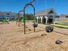 Mailbox kiosk backs up to playground.