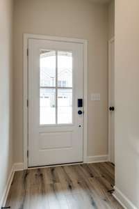 Upgraded glass front door (very similar completed home)