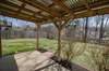 Backyard with a tin roof awning.