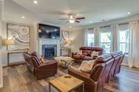 Living Room w/ Recessed Lighting, Gas Fireplace w/ Mantle & Access to Outdoor Patio