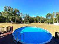 Pool has a deck around it. Completely private! Swim and watch the deer and wild life