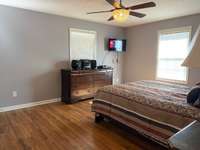 Guest Bedroom is large with full bath! Laminate flooring with ceiling fan, fresh paint and walk in closet