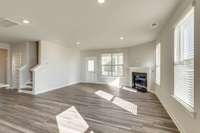 View From Kitchen Into The Great RM!  Access To The Rear Covered Porch Off Great Room!