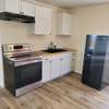 New kitchen with its new designer black sink and all natural oak wood counter top shines!  All plumbing is brand new. No worries here!