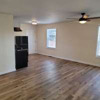 Another angle of the large sized living area and plenty of room for a dining table. New light and bright paint gives the cabin a fresh look!