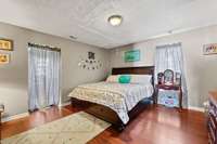 Large primary bedroom on main level with huge bathroom