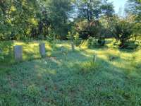 There is a cemetery on property in back yard.
