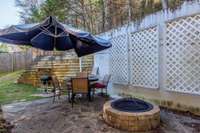 Perfect outdoor patio space featuring fire pit, flowerbeds, and OUTDOOR STORAGE CLOSET. 