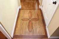 Beautiful hardwood flooring.  This is the design at the front entrance doorway.