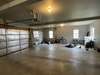 Spacious climate controlled garage with laundry sink and washer dryer hookups